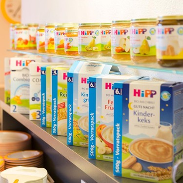 Large selection of organic baby food and children's muesli from HiPP on shelves in Hotel Ramsi.
